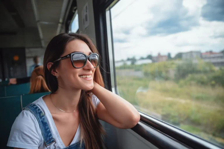 girl looking through train window