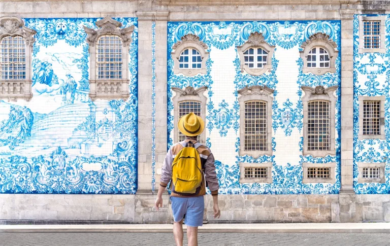 Man blue tiled building Porto