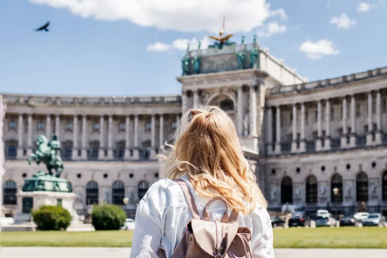Woman looking to Hofburg in Vienna